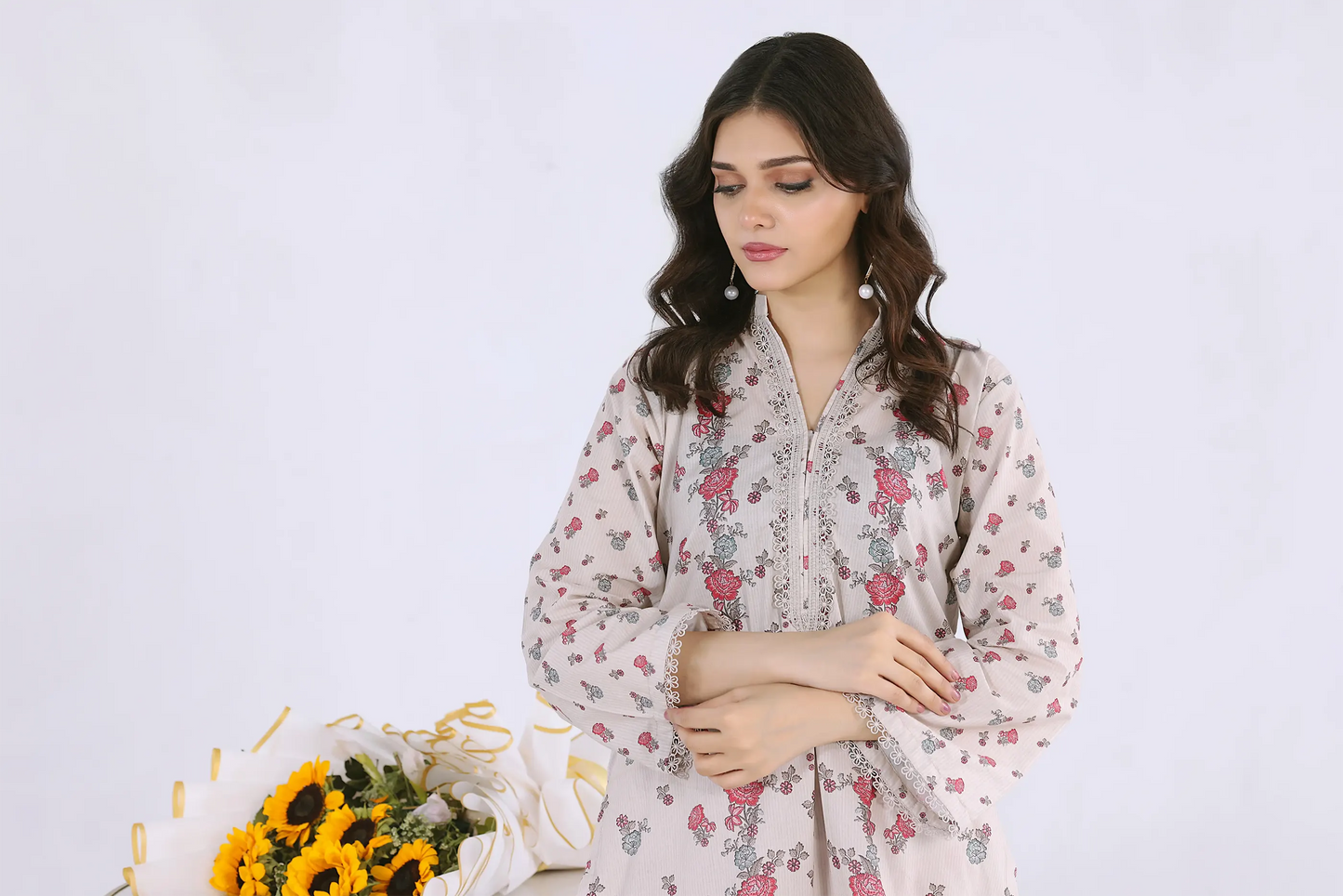 view of matching co-ord set showing delicate lace finishing on sleeves and shirt hem for a boutique look.