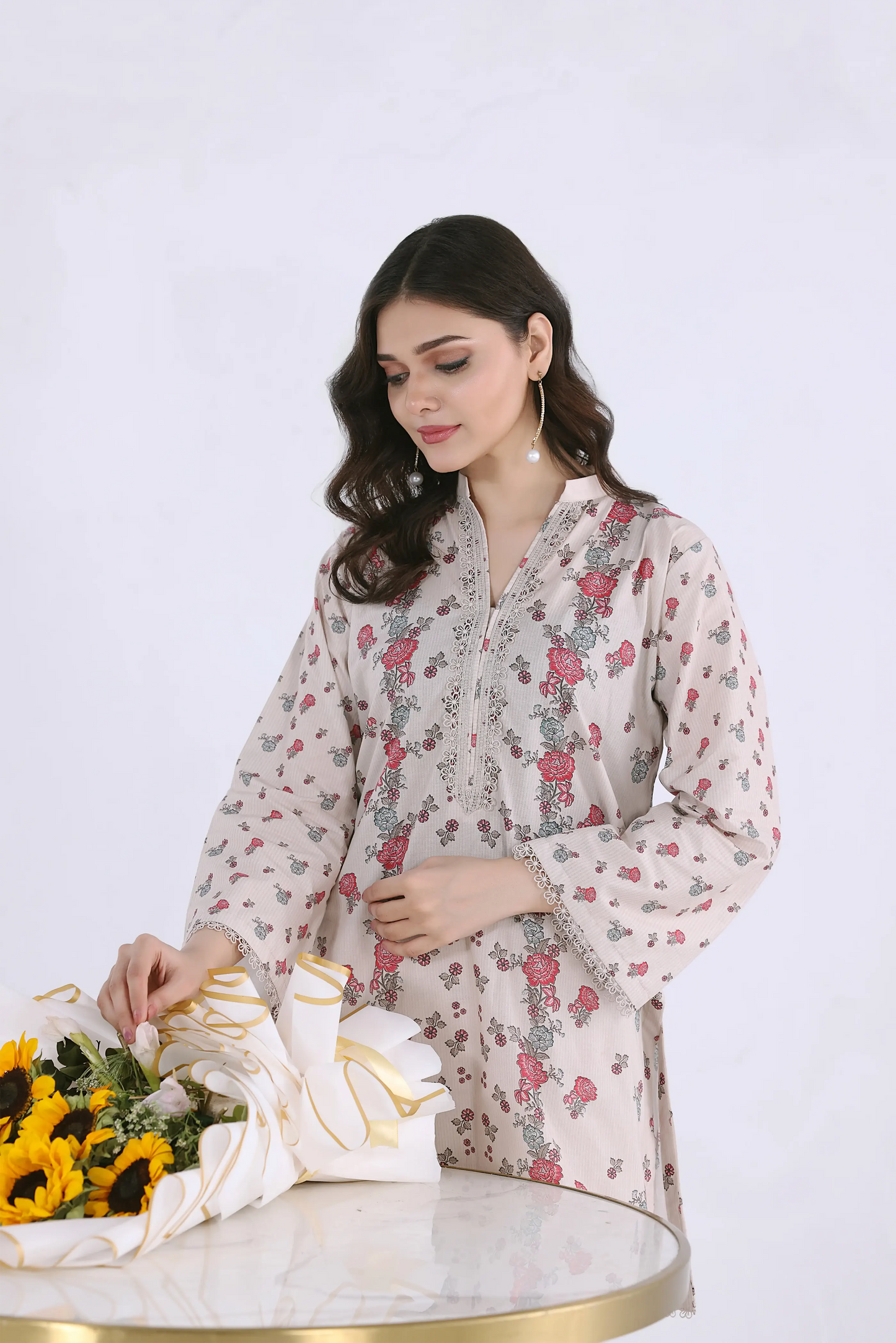 Close-up of embroidered V-neckline and intricate floral print on a premium cotton lawn co-ord shirt.