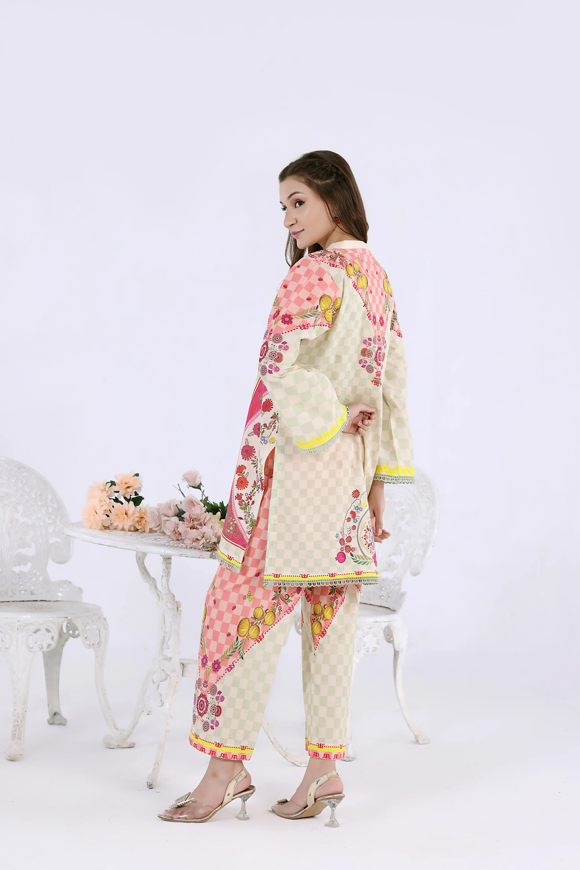 Rear view of a breathable cotton lawn co-ord set showing the vibrant pink floral back detail and wide-leg trousers.