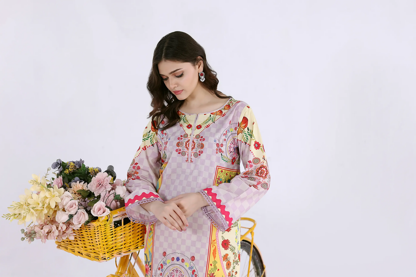 Close-up of the digital print shirt featuring the round neckline, intricate floral pattern, and magenta scalloped lace.