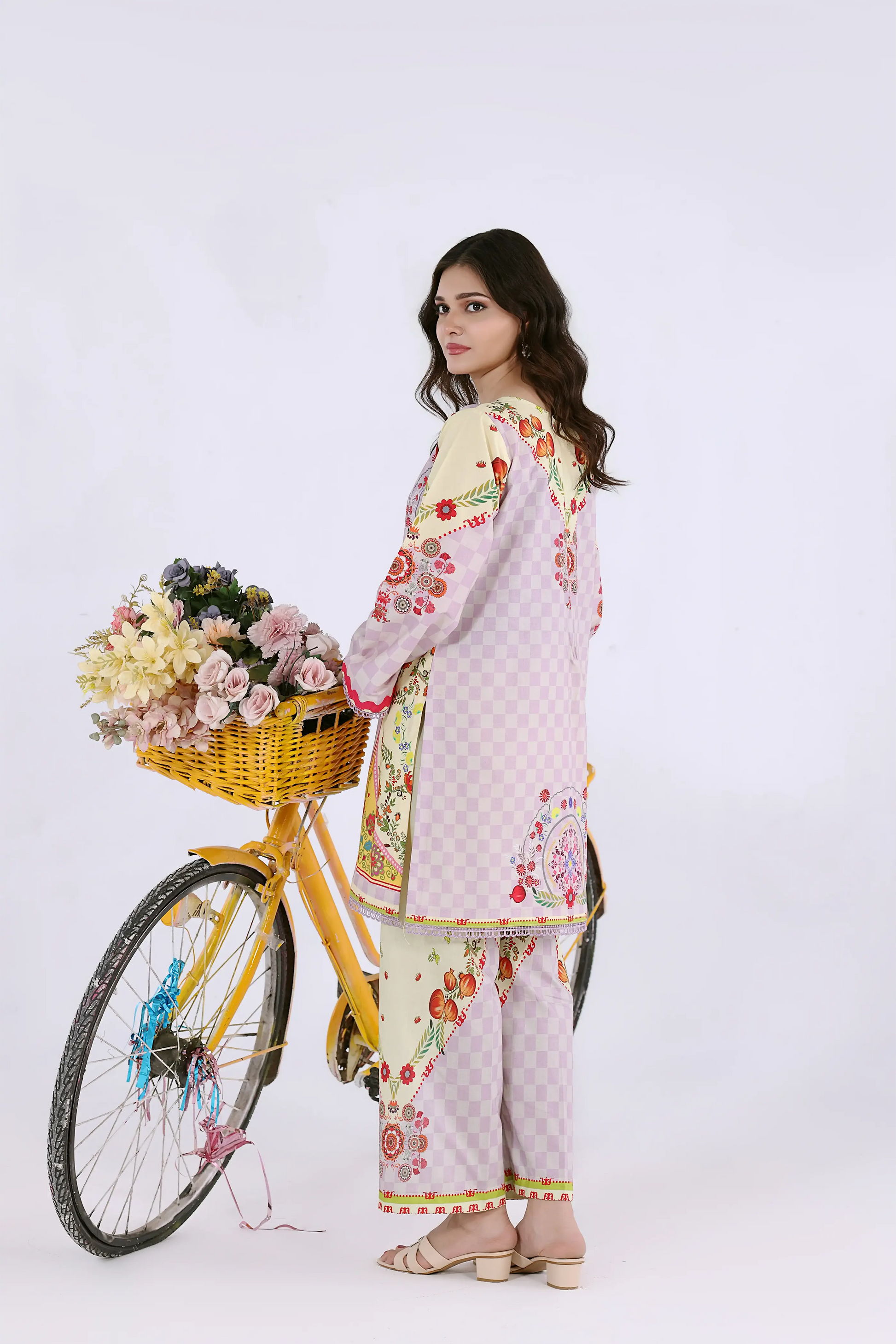 Rear view of a breathable cotton lawn co-ord set showing the lavender checkered pattern and matching wide-leg trousers.