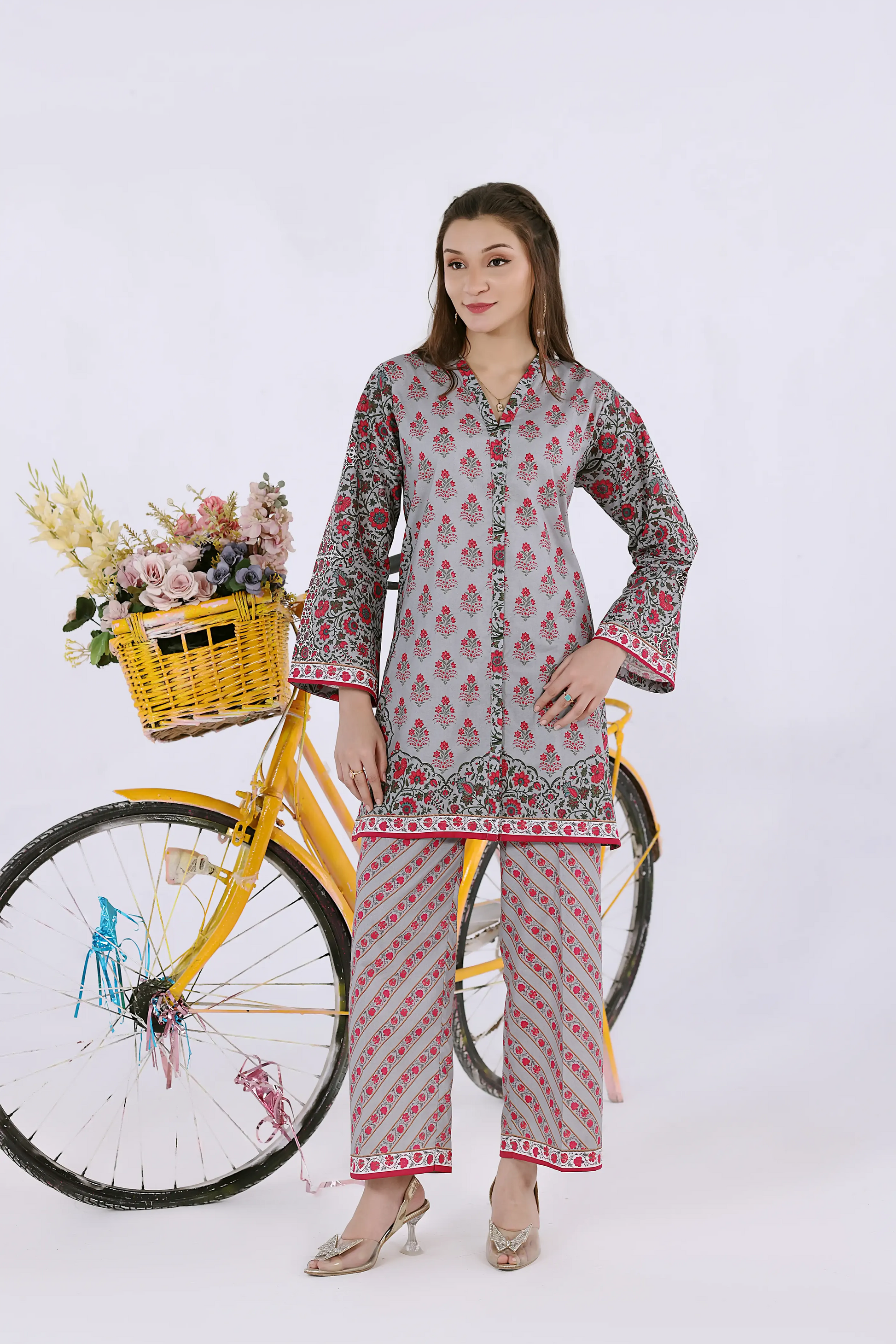Standing view of the slate teal co-ord set showing the intricate digital print and matching trouser patterns.