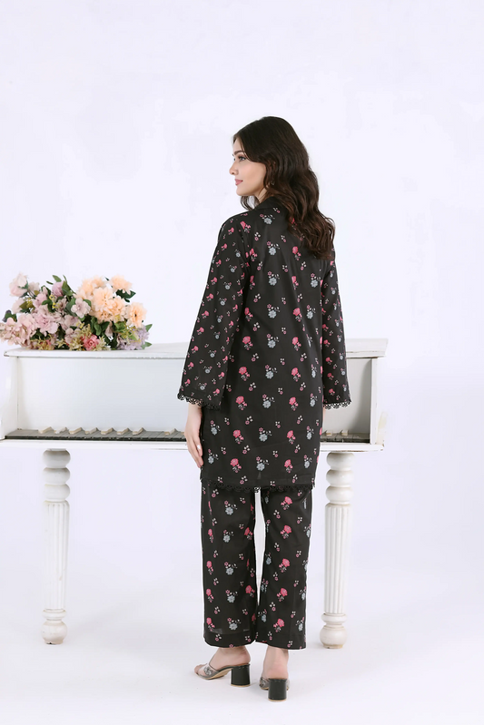 Side-back view of the black co-ord set showing the straight silhouette and matching printed trousers.